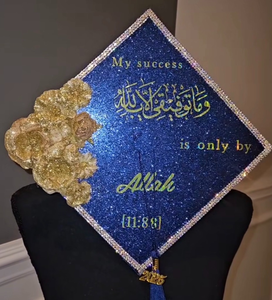 Blue glitter graduation cap with Quran verse and gold flowers