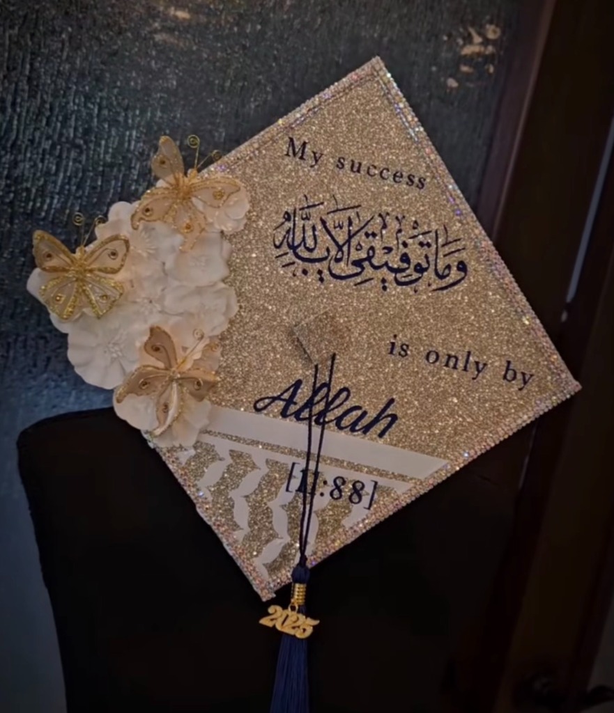 Gold glitter graduation cap with Arabic calligraphy — My success is only by Allah