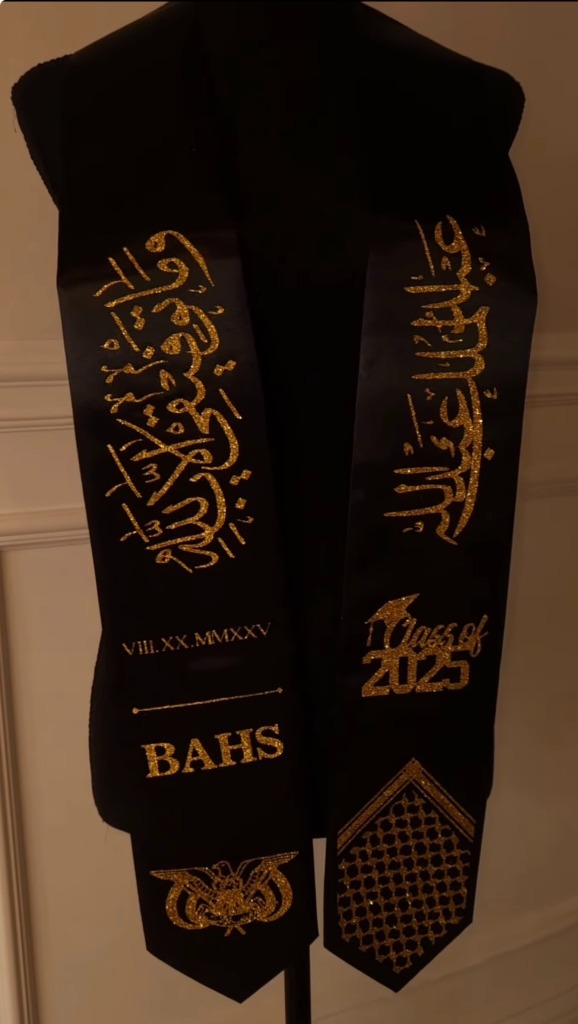 Black and gold graduation stole with Yemen eagle emblem and gold calligraphy