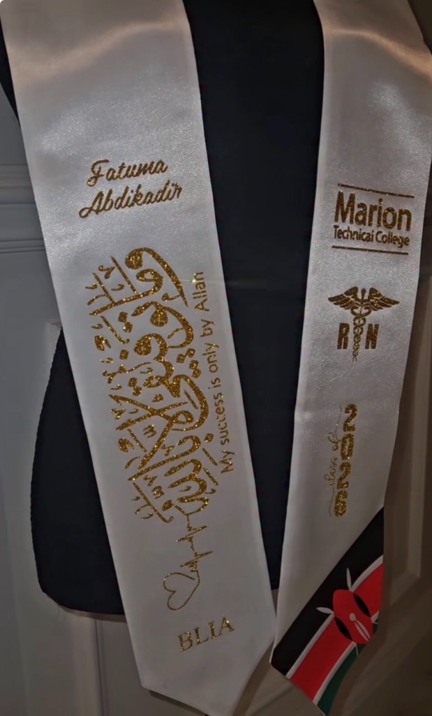 White graduation stole with green glitter Arabic calligraphy and Kenya flag