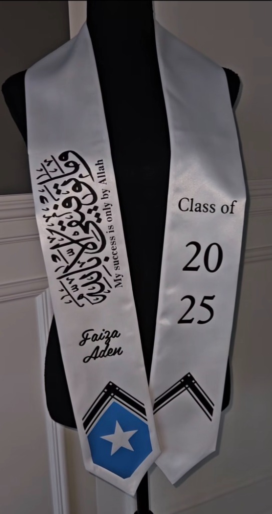 White graduation stole with black Arabic calligraphy and Somalia flag
